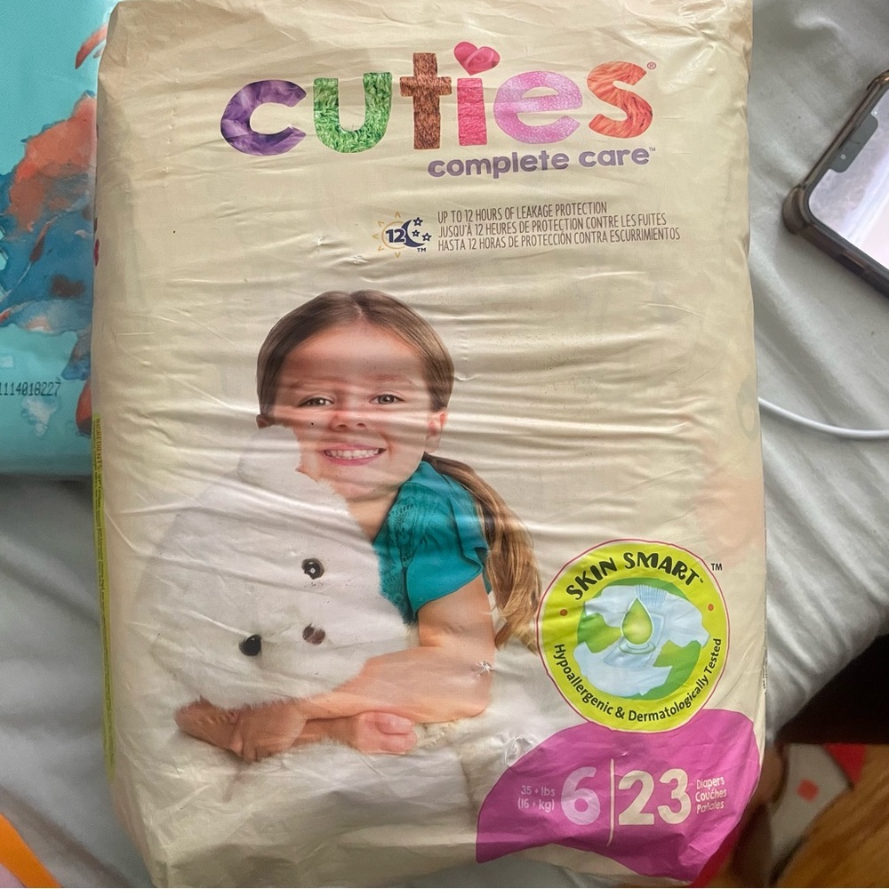 Cuties Complete Care Diapers - Cream with Multicolor Logo
